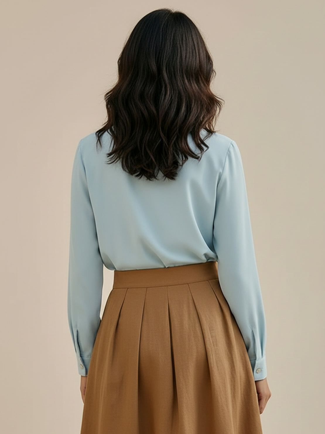 Pleated V-neck long-sleeve blouse with diagonal pleated panel and button cuffs