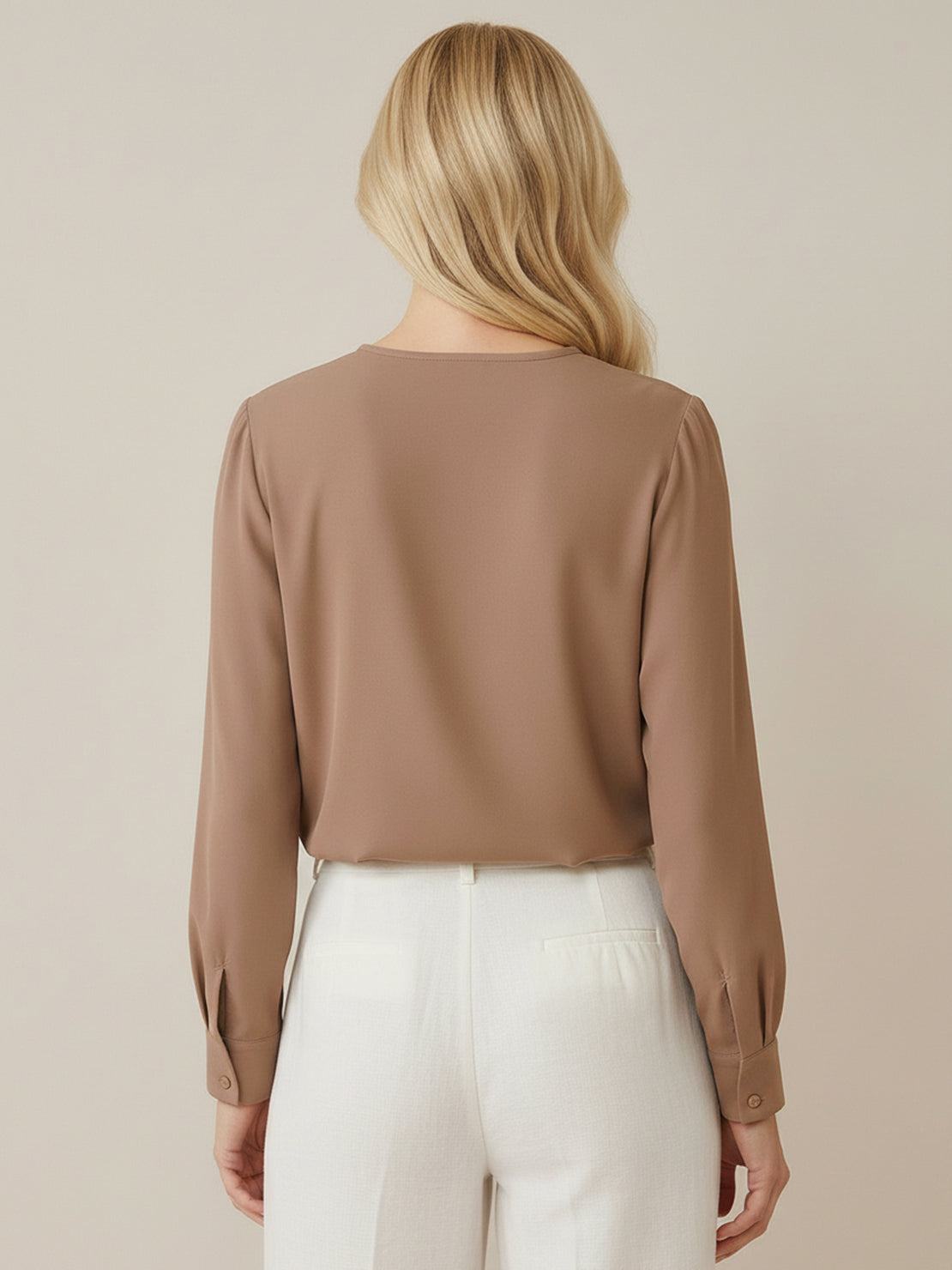 White pleated V-neck long-sleeve blouse with diagonal pleated panel and button cuffs