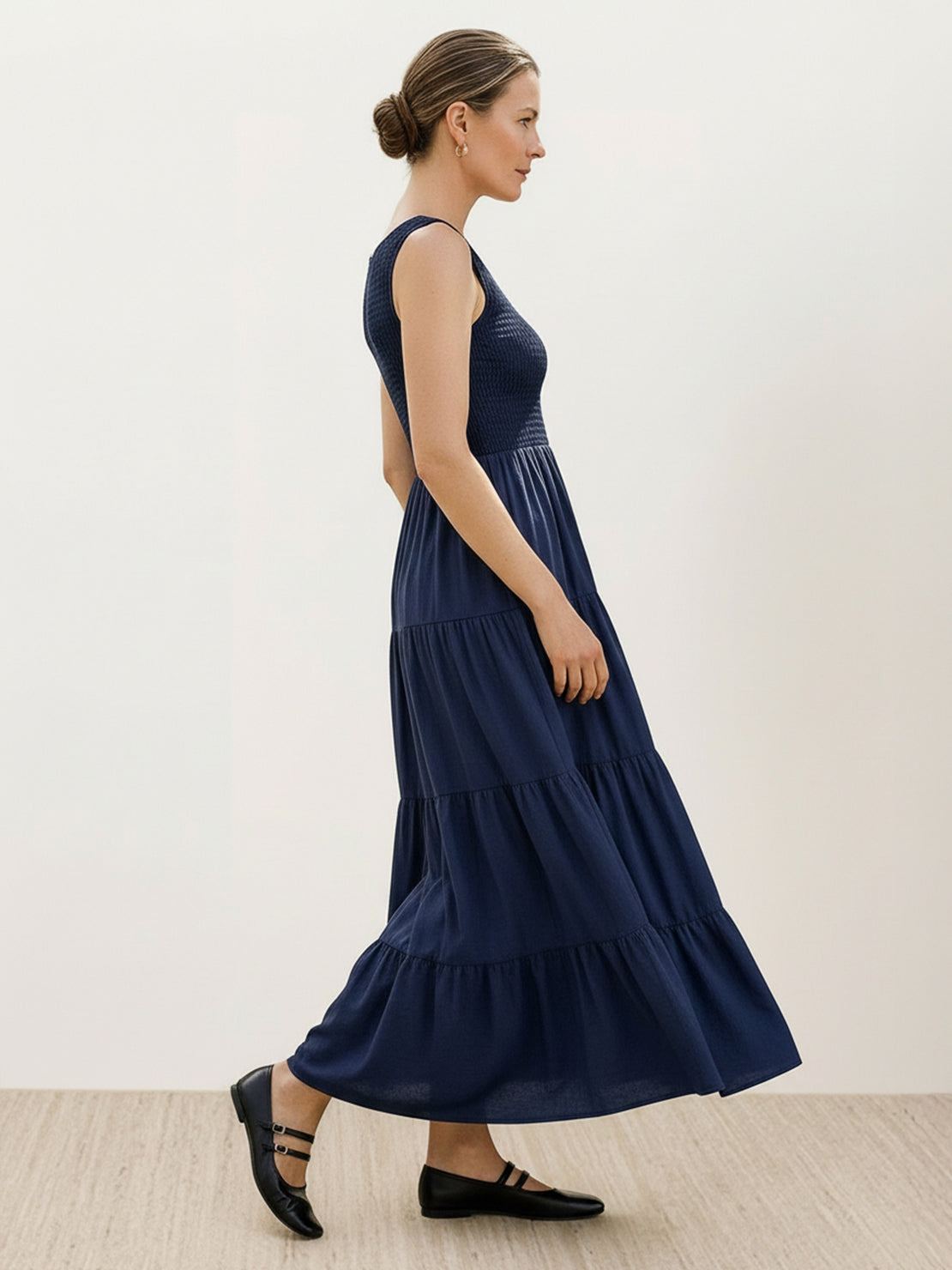 Smocked sleeveless maxi dress with tiered skirt and scoop neckline