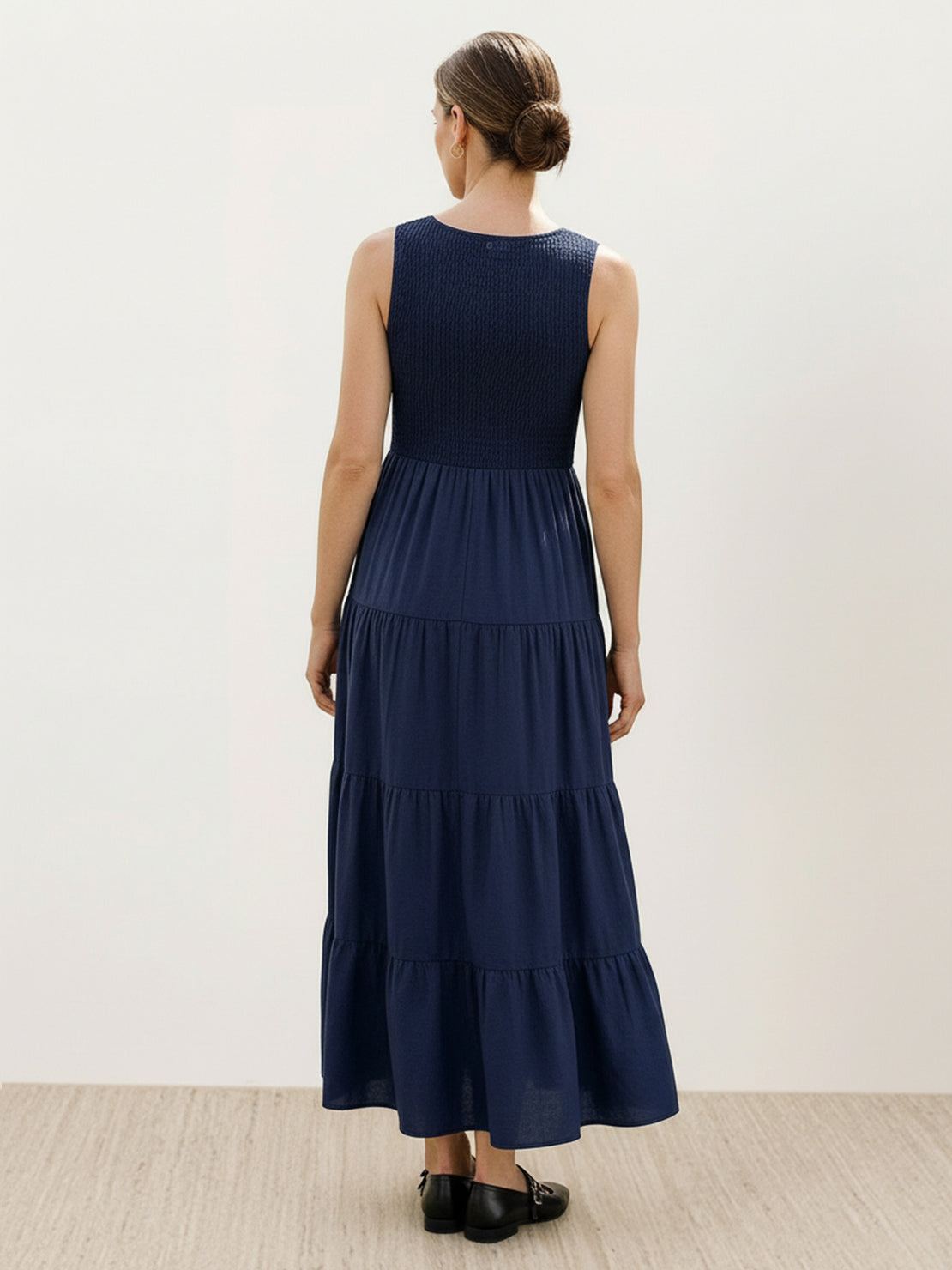 Smocked sleeveless maxi dress with tiered skirt and scoop neckline in lightweight fabric