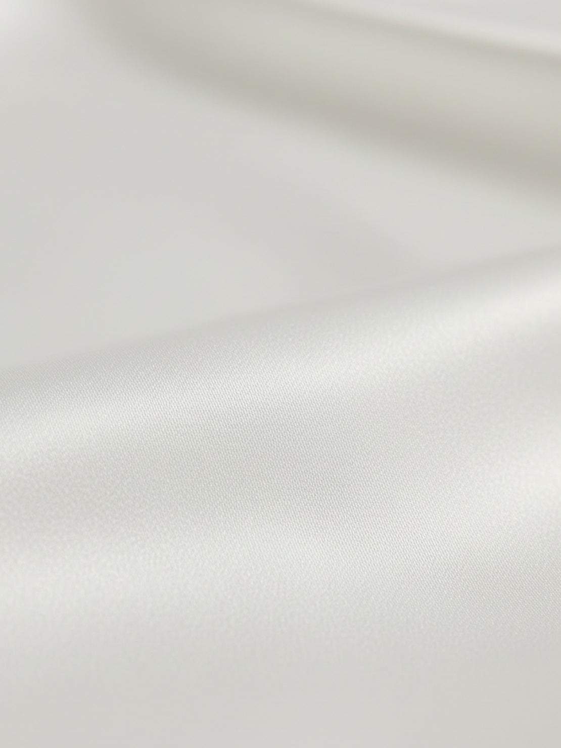 silk-finish button front shirt with traditional collar and curved hem in smooth polyester blend fabric