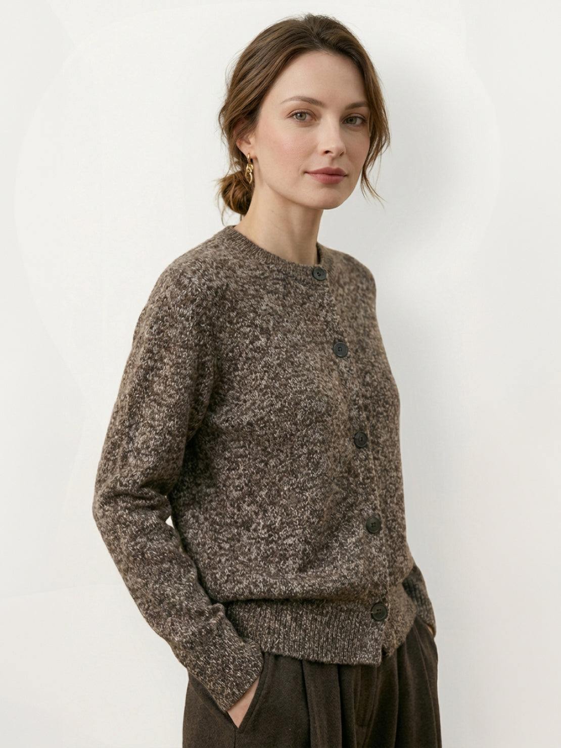 Marled knit merino wool cardigan with contrasting buttons and ribbed cuffs, warm and breathable layering piece