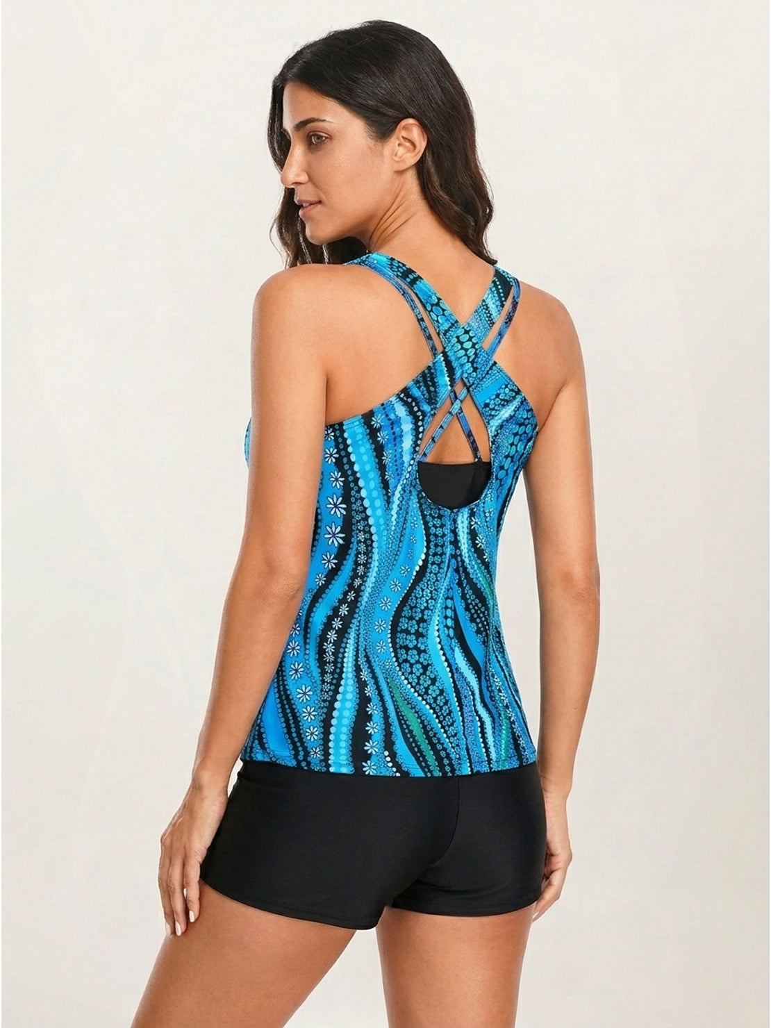 Three-piece criss-cross back tankini set with loose scoop neck tank, printed sports bra, and boy shorts