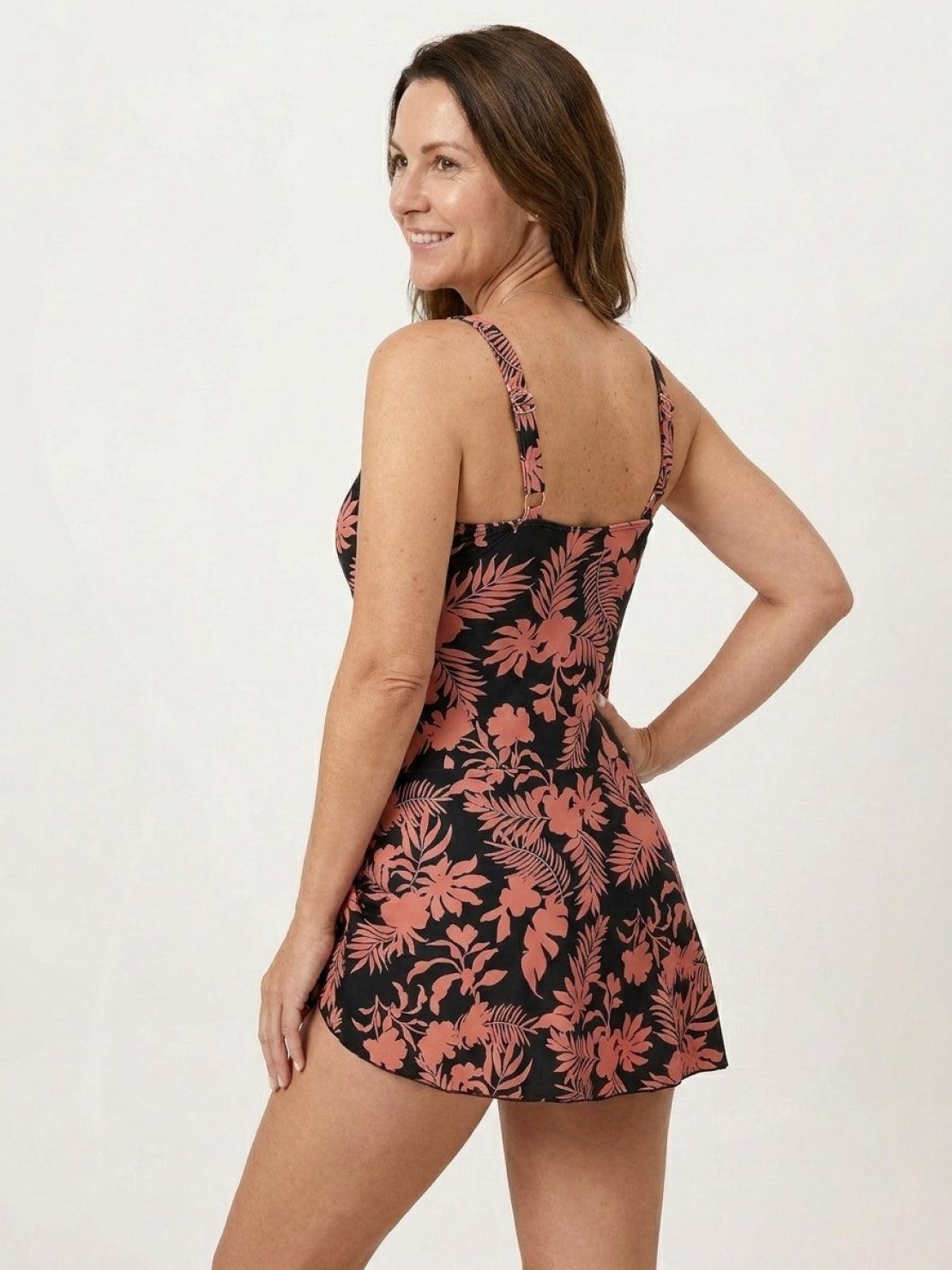 Ruched wrap one-piece swimdress with adjustable straps and tie-front skirt on model