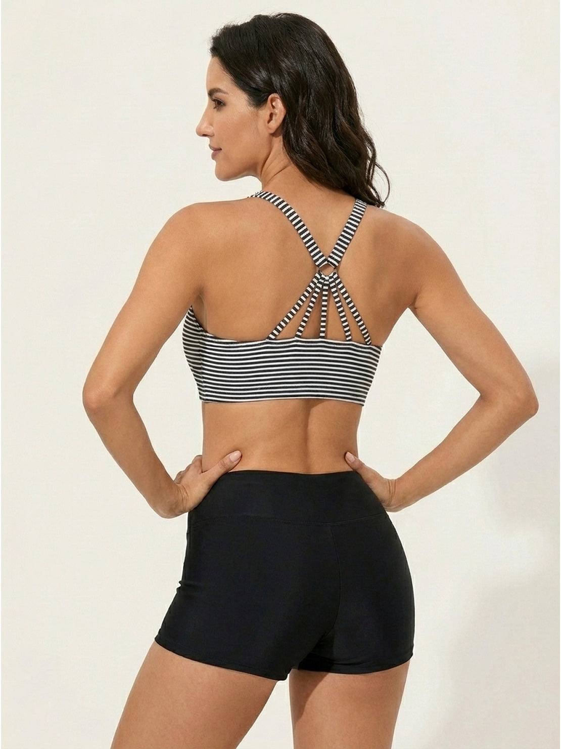 Three-piece open-back swim set with loose tank, racerback crop bra, and mid-rise boy shorts