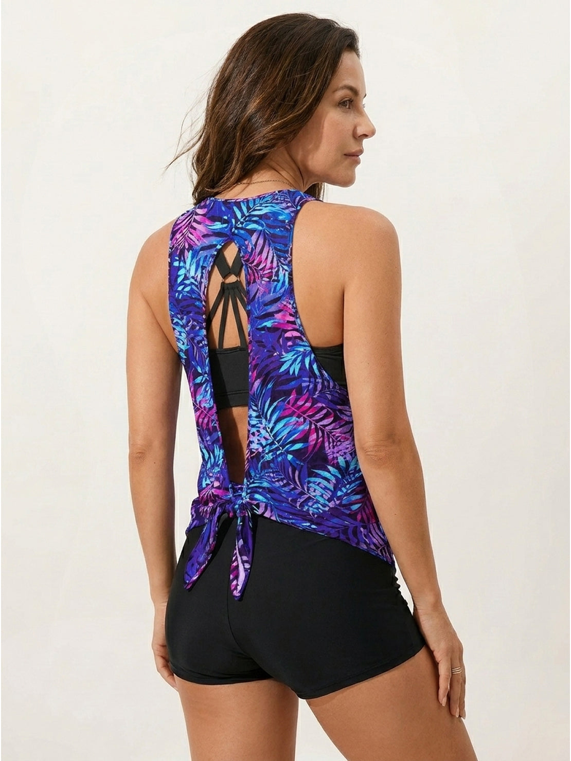 Three-piece open-back swim set with loose tank, racerback crop bra, and mid-rise boy shorts