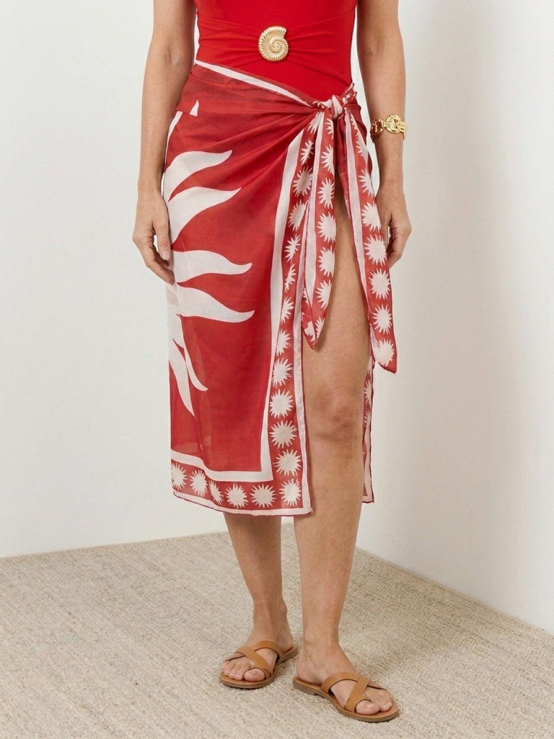 Deep-V one-piece swimsuit with ruching and sheer celestial print sarong wrap