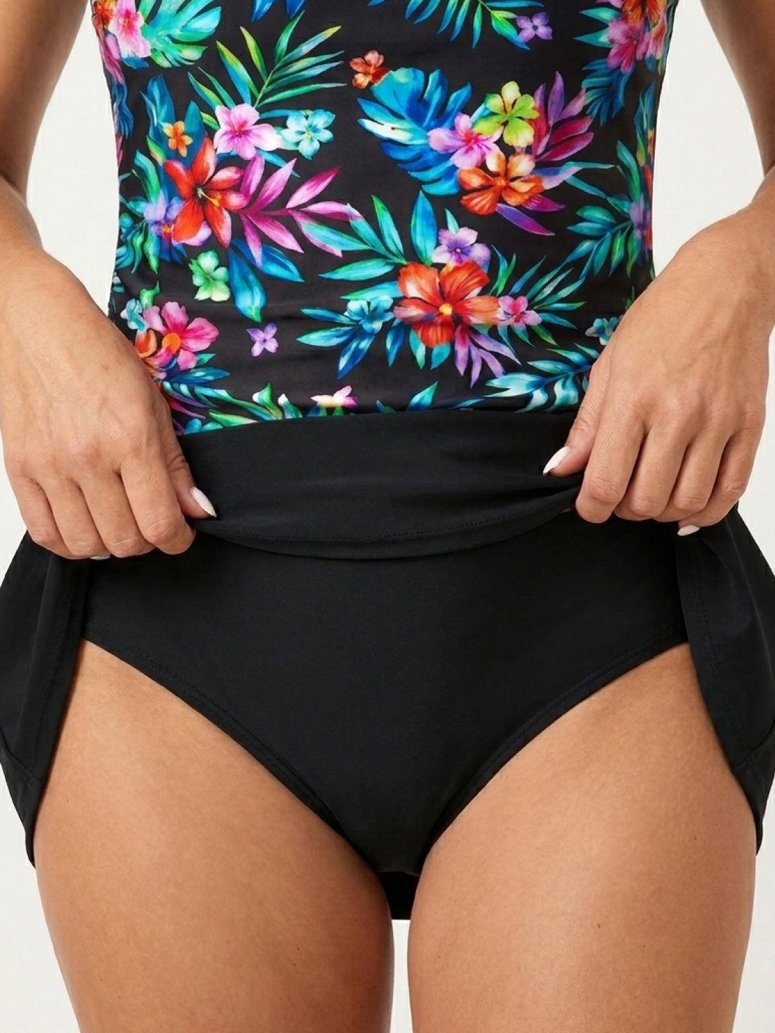 High-neck ruched tankini set with printed top and solid bottom, side ruching, and built-in shelf bra.