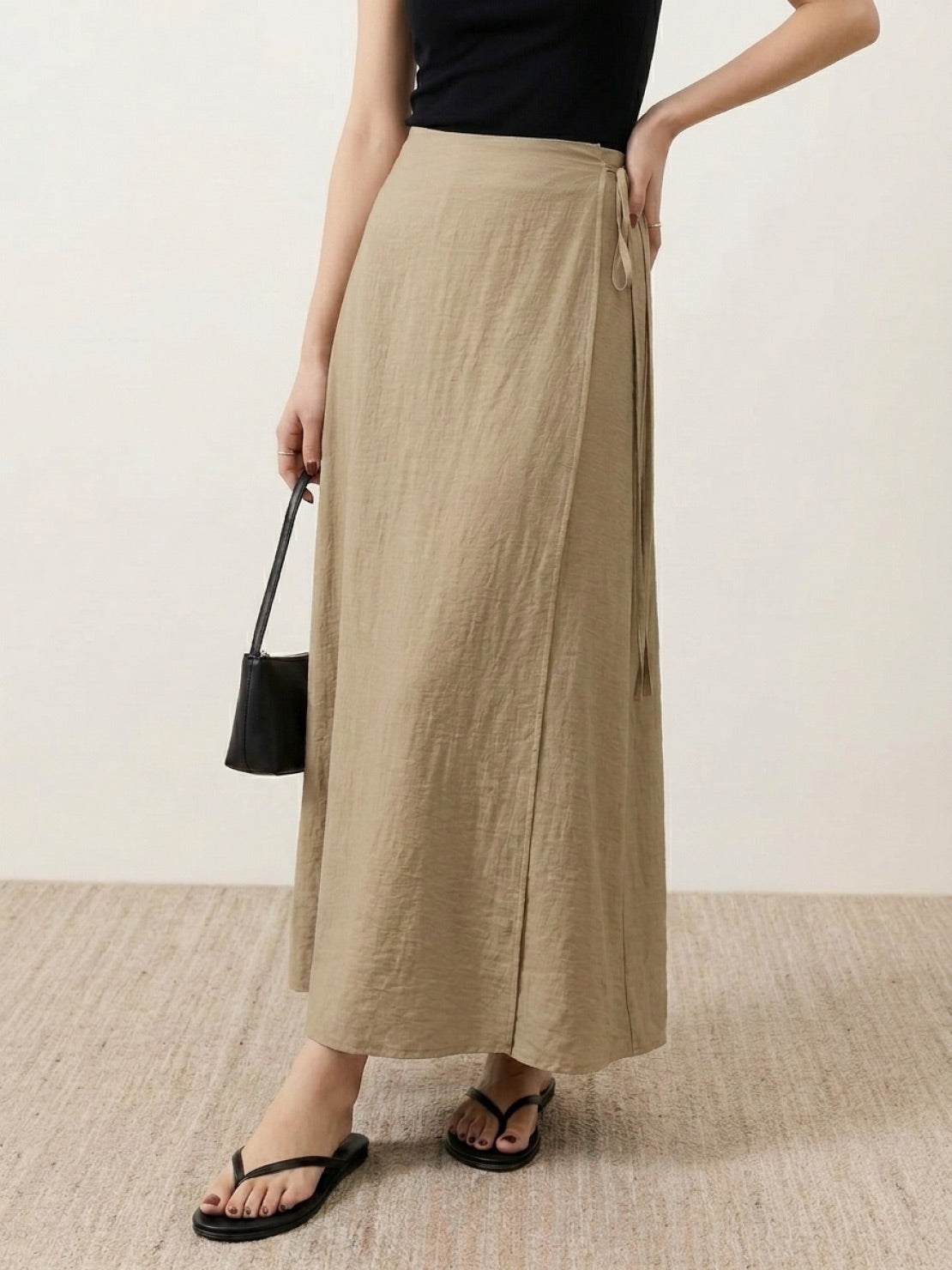 Asymmetrical wrap maxi skirt with side tie closure and flowy lightweight fabric