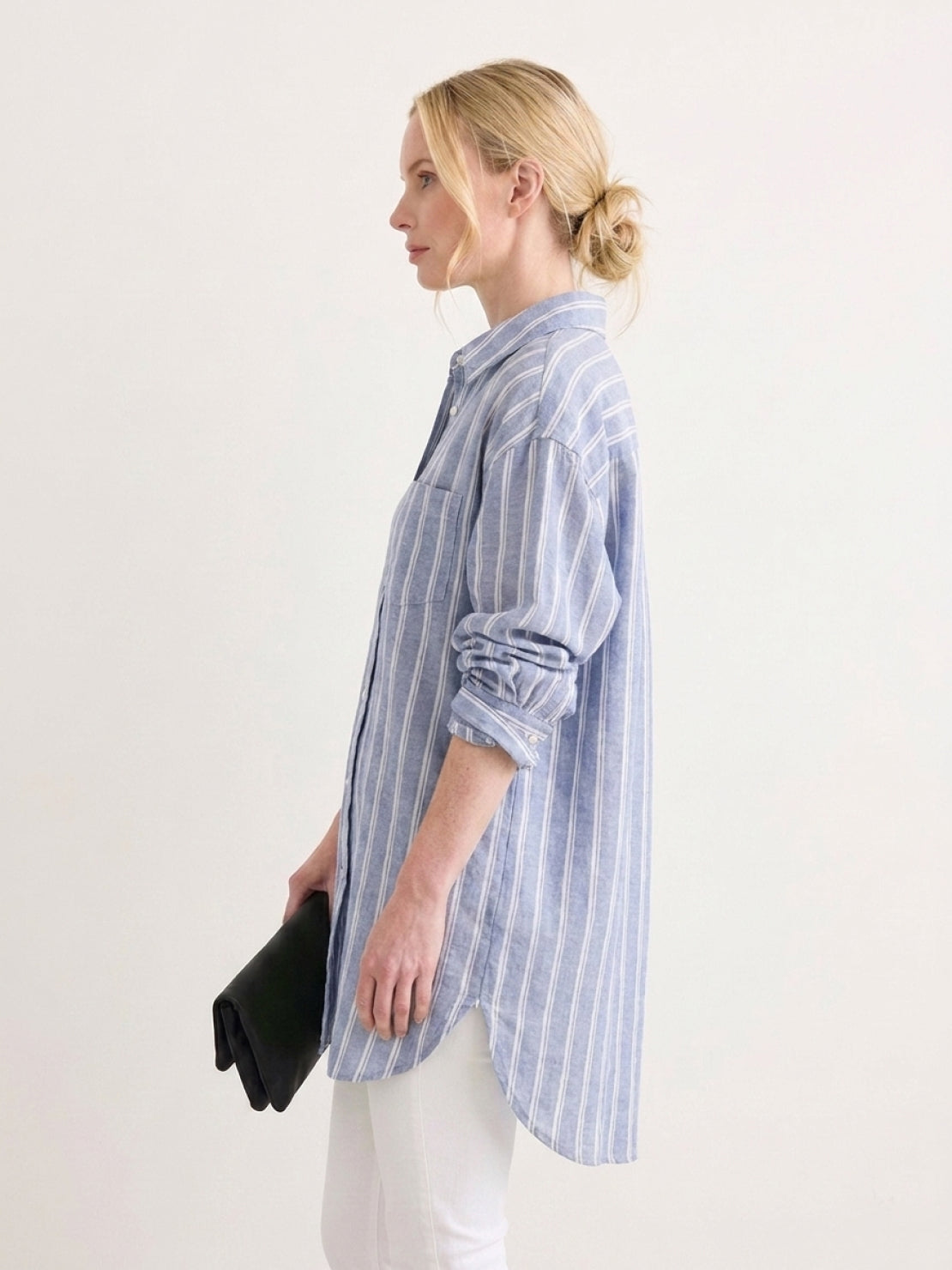 Oversized linen shirt with relaxed fit, dropped shoulders, back-pleat detail, and button cuffs in coastal stripe pattern