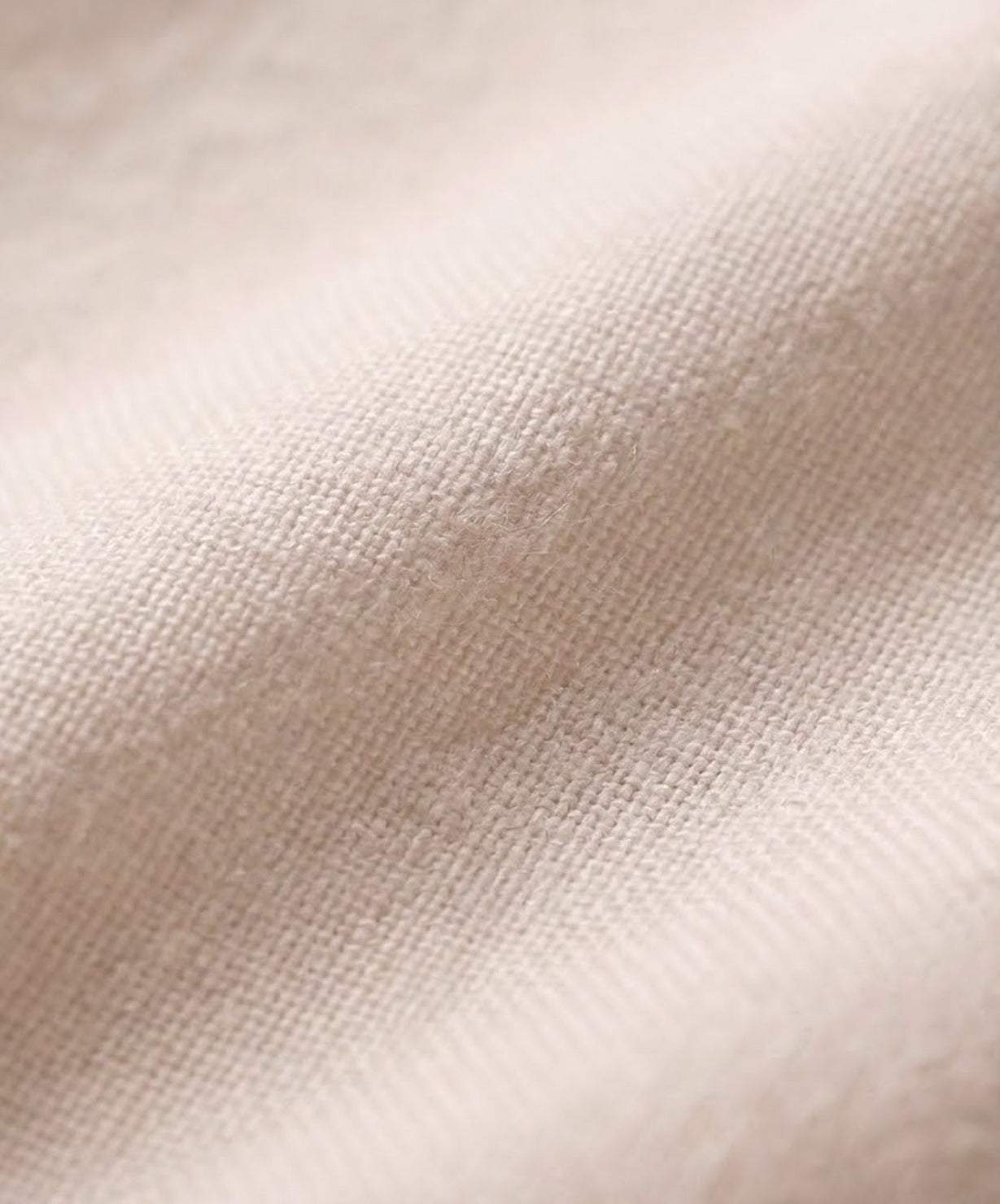 Close-up of soft mid-lightweight breathable cotton fabric for short-sleeved pullover and wide trouser matching set