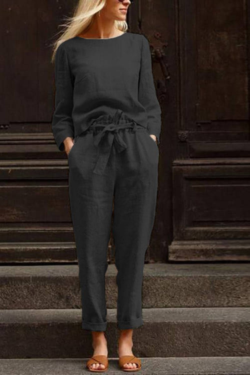 Woman wearing black cotton-linen monochrome longline top and wide-leg pants set with relaxed fit and tied waist