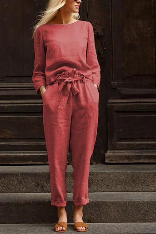 Woman wearing relaxed cotton-linen monochrome capsule set with longline top and wide-leg pants in muted rose color