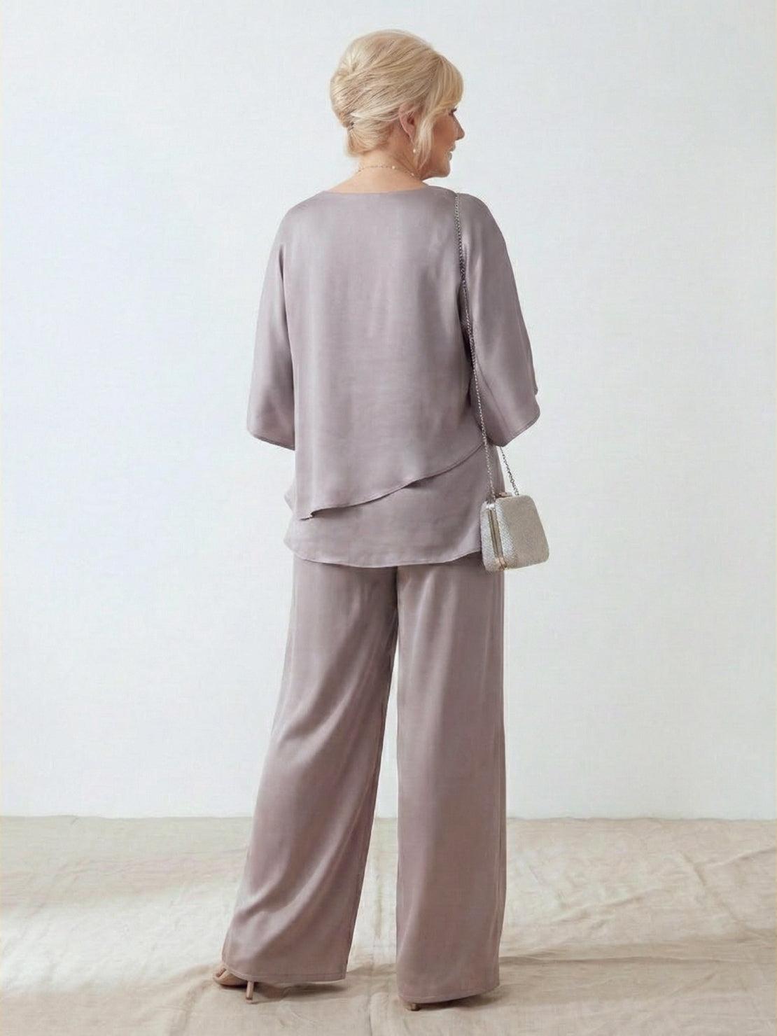 Woman wearing Elegant Layers Two-Piece Set with layered V-neck top and matching pants in light fabric