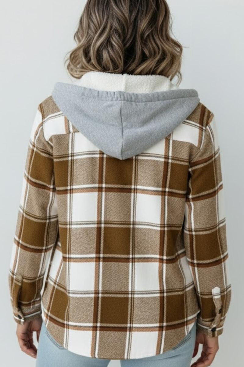 Back view of woman wearing Highland Plaid Shacket with brown and white plaid, gray hood, and fleece lining.