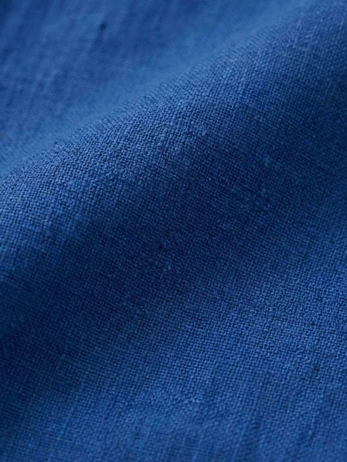 Close-up of blue breathable cotton blend fabric for loose solid color two-piece set