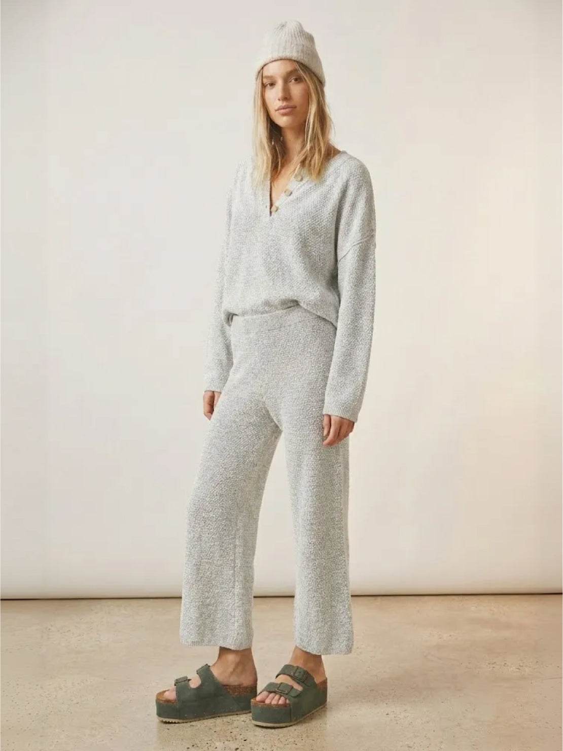 Woman wearing multi-weather comfort two-piece oversized set with cropped wide pants and long-sleeve top in casual stylish outfit