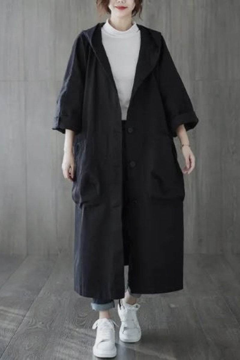 One size fits all oversized water resistant windbreaker jacket with hood and large front pockets, styled for layering and lightweight protection against wind and rain.