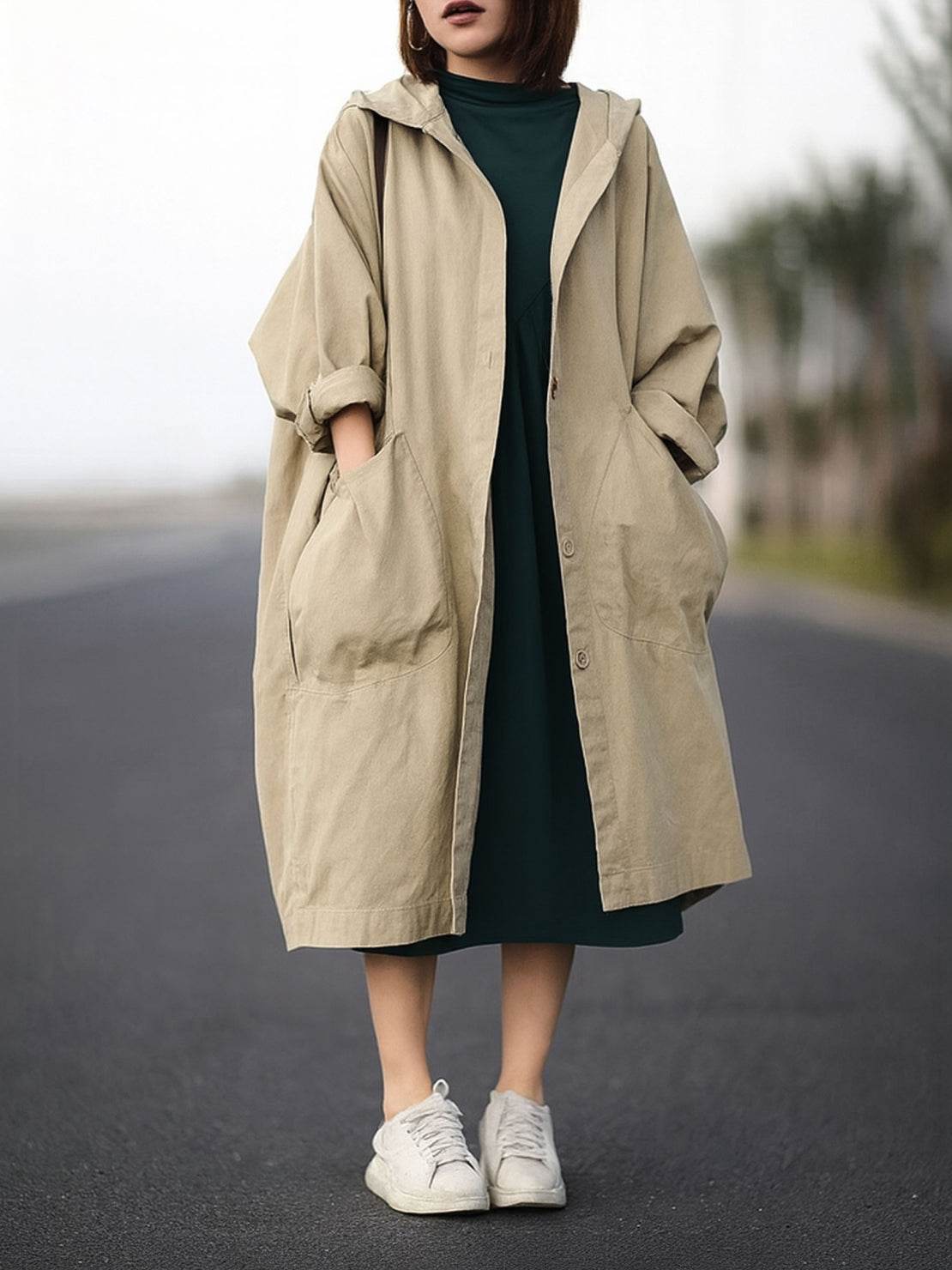 Oversized water-resistant windbreaker jacket with hood and large pockets, lightweight waterproof design for layering and trans-seasonal wear