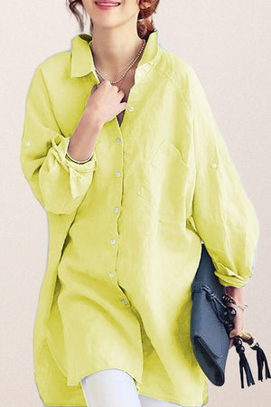 Light yellow oversized linen shirt with button front and long sleeves, styled casually with accessories.