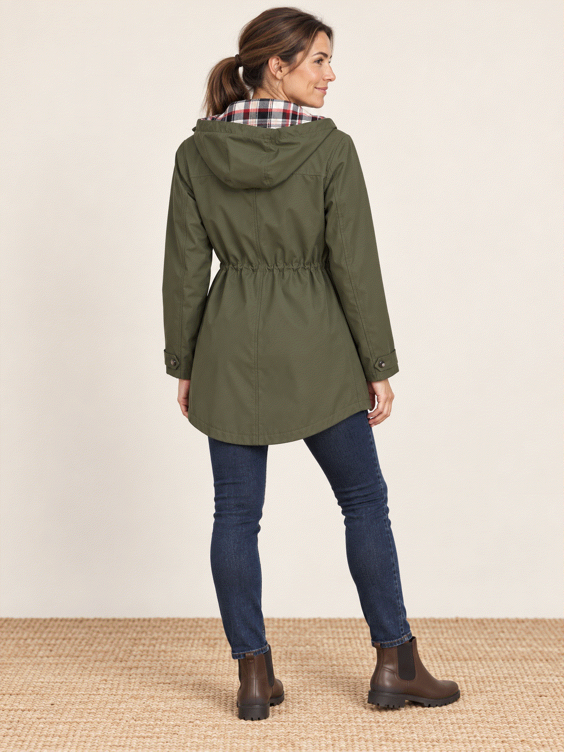 Plaid-lined hooded rain jacket with waterproof shell and red-cream tartan lining