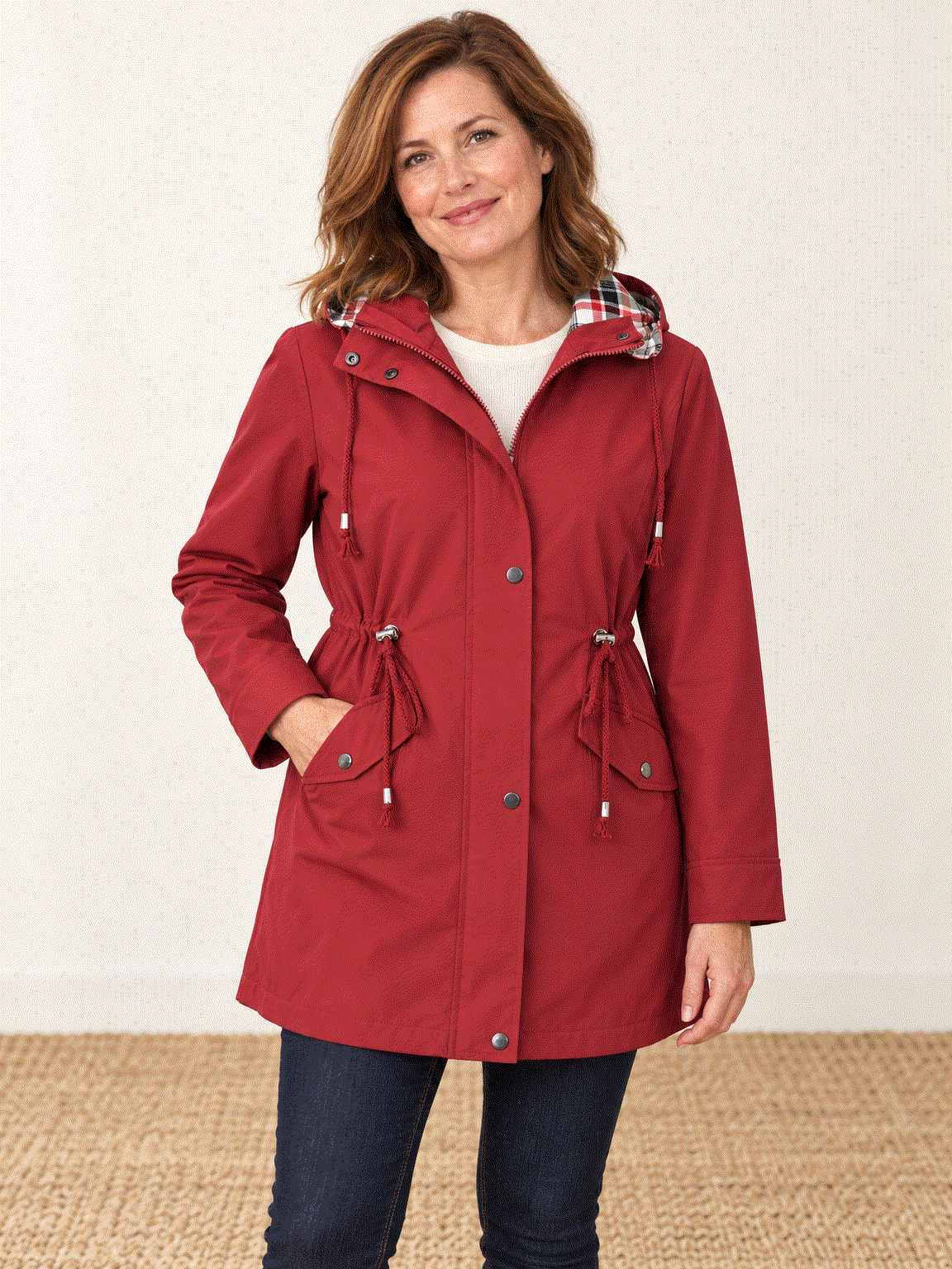 Plaid-lined hooded rain jacket with waterproof shell and drawstring waist