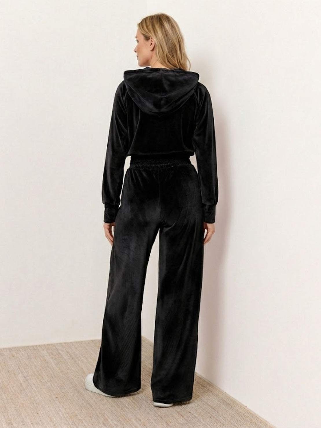 Modern cropped velour tracksuit set with high-waist pants and plush texture