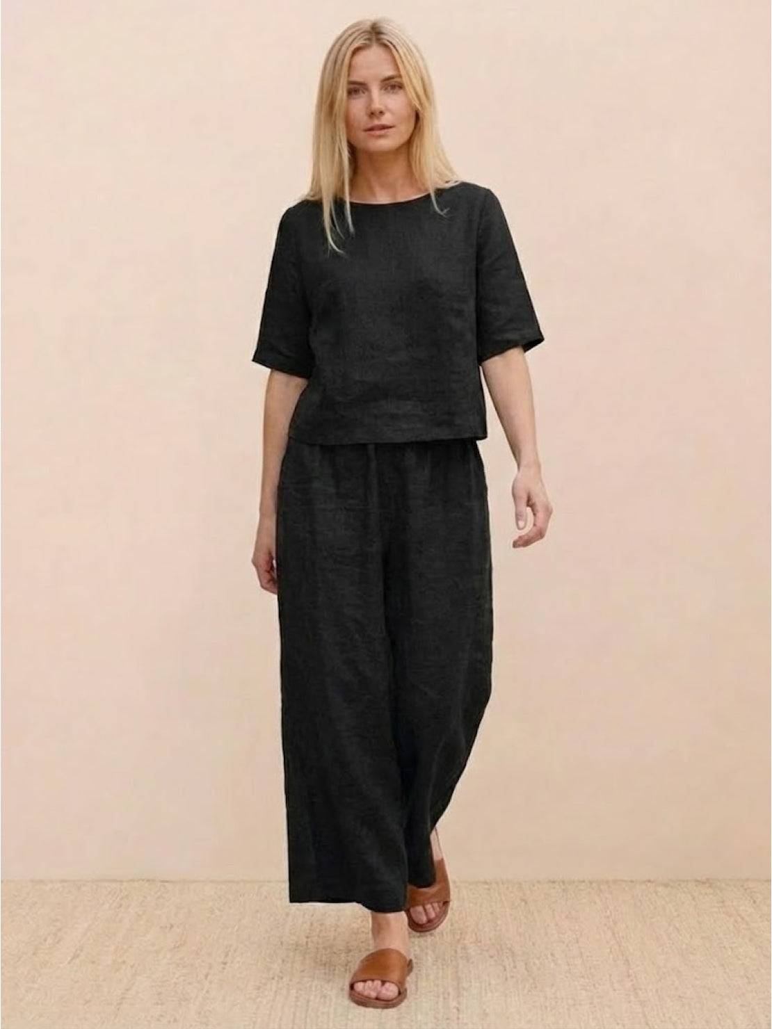 Loose fit black co-ord set with short sleeves and wide-leg pants for relaxed comfort and effortless style