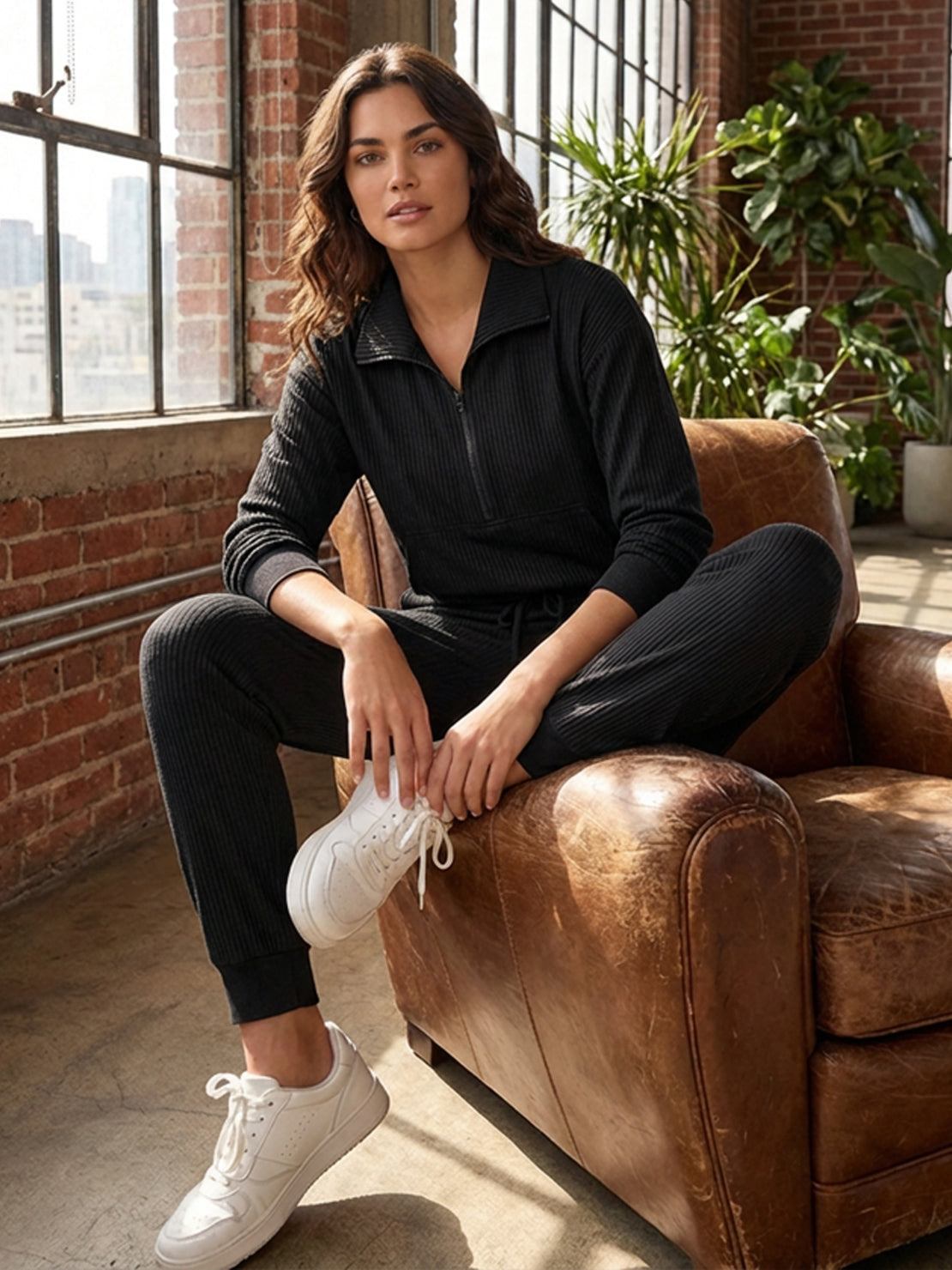 Unisex half-zip pullover and sweatpants set in soft fabric with relaxed fit for casual wear and travel