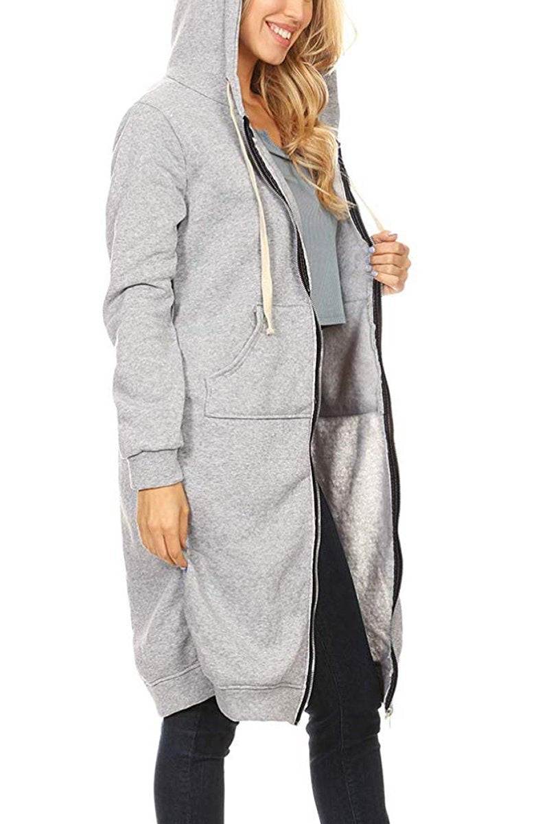 Woman wearing oversized long zip sweatshirt hoodie in grey with hood and fleece lining