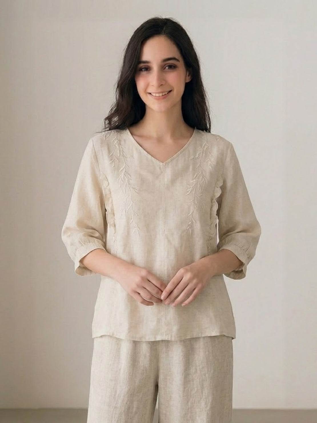 100% cotton linen blend coordinated set with embroidered V-neck top and high-waisted wide-leg trousers