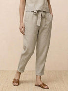 Cotton linen monochrome straight-leg pants with adjustable drawstring waist and natural textured fabric