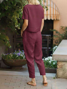 Cotton linen monochrome straight-leg pants with drawstring waist and natural texture