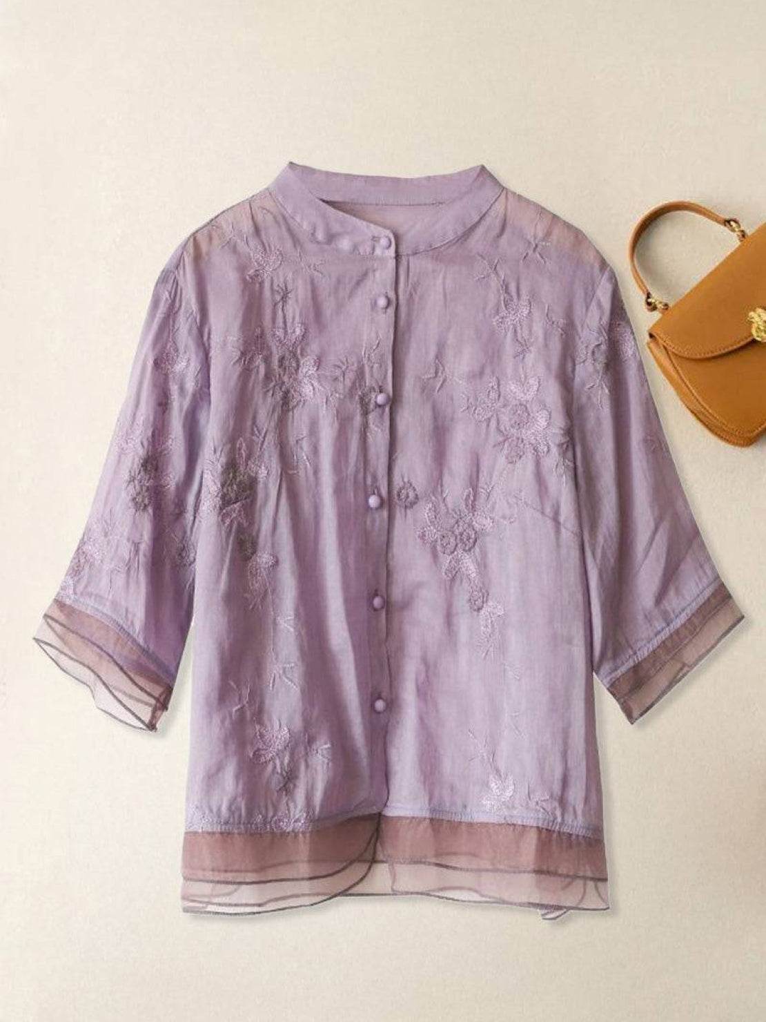 Close-up of 100% Cotton Linen Tuscany embroidered top and wide-leg linen trousers set in natural beige tone