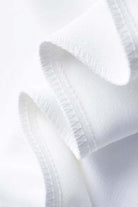 Close-up of soft white fabric for casual loose wide-leg high-waisted pants