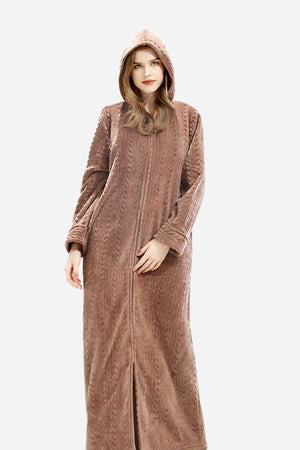 Woman wearing stylish flannel nightgown with hood, soft thick fabric, and zipper front