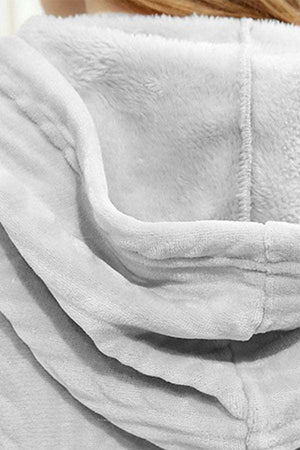 Close-up of soft, thick hood detail of stylish flannel nightgown in cozy white fabric