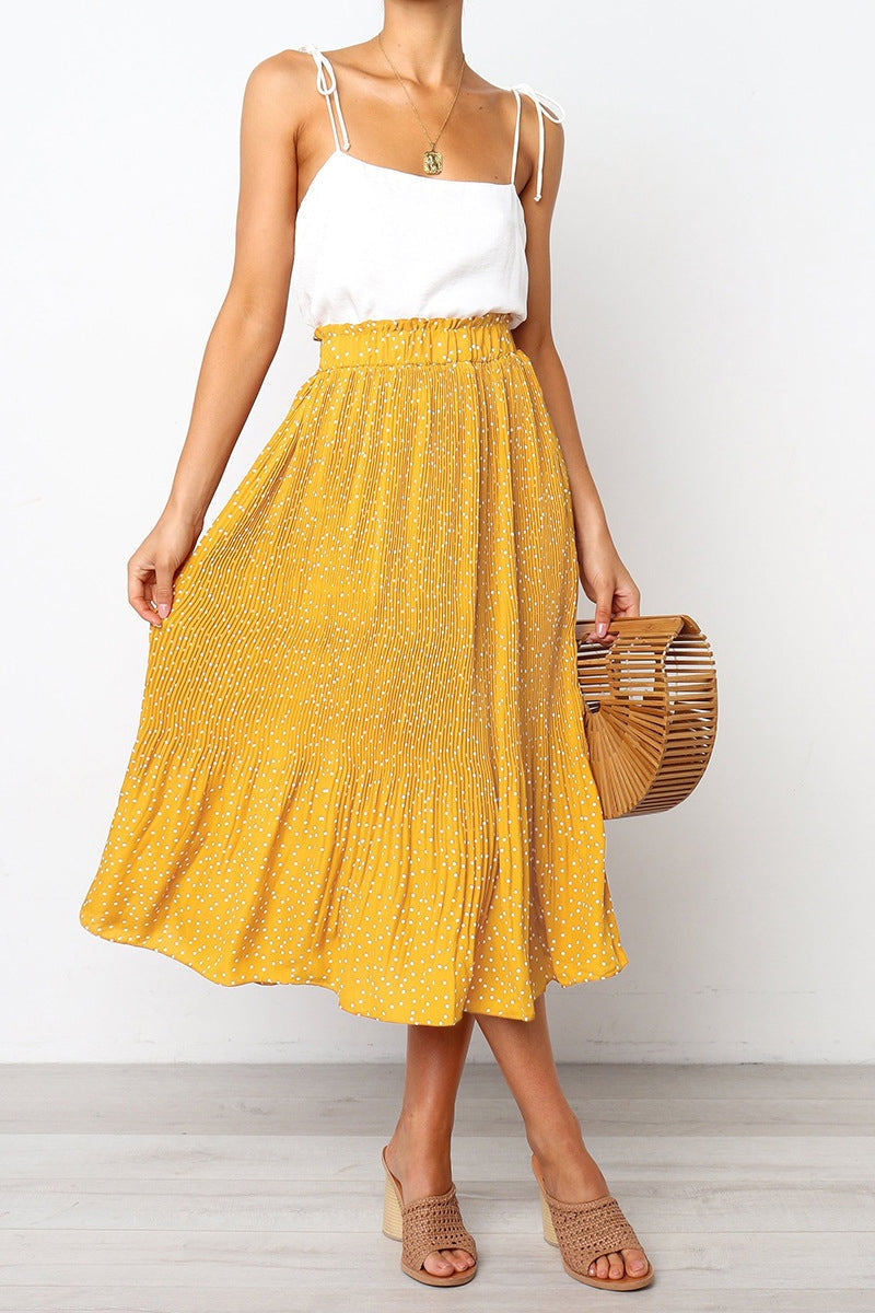 Effortlessly Chic Polka Dot Pleated Skirt in yellow midi length with high waist and pockets.