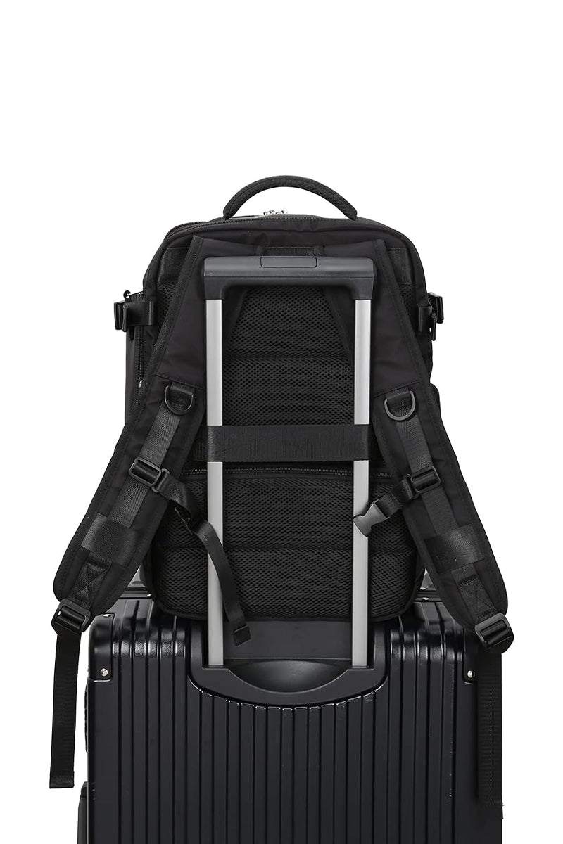Chic Wanderlust Waterproof Backpack attached to suitcase handle, black ergonomic travel bag with padded straps and durable fabric
