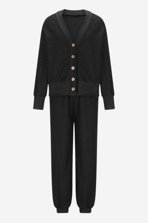 Black two-piece knitwear set with buttoned cardigan and relaxed pants, soft polyester fabric, comfortable and versatile design.