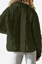 Lightweight puffer travel jacket in black, compact and packable, ideal for versatile and eco-conscious travel