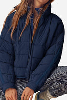 Lightweight puffer travel jacket packed compactly for easy packing and travel warmth
