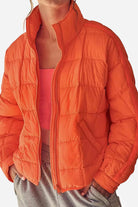 woman wearing lightweight puffer travel jacket outdoors