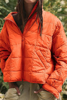 lightweight puffer travel jacket packed compactly for easy travel and versatile style in multiple colors