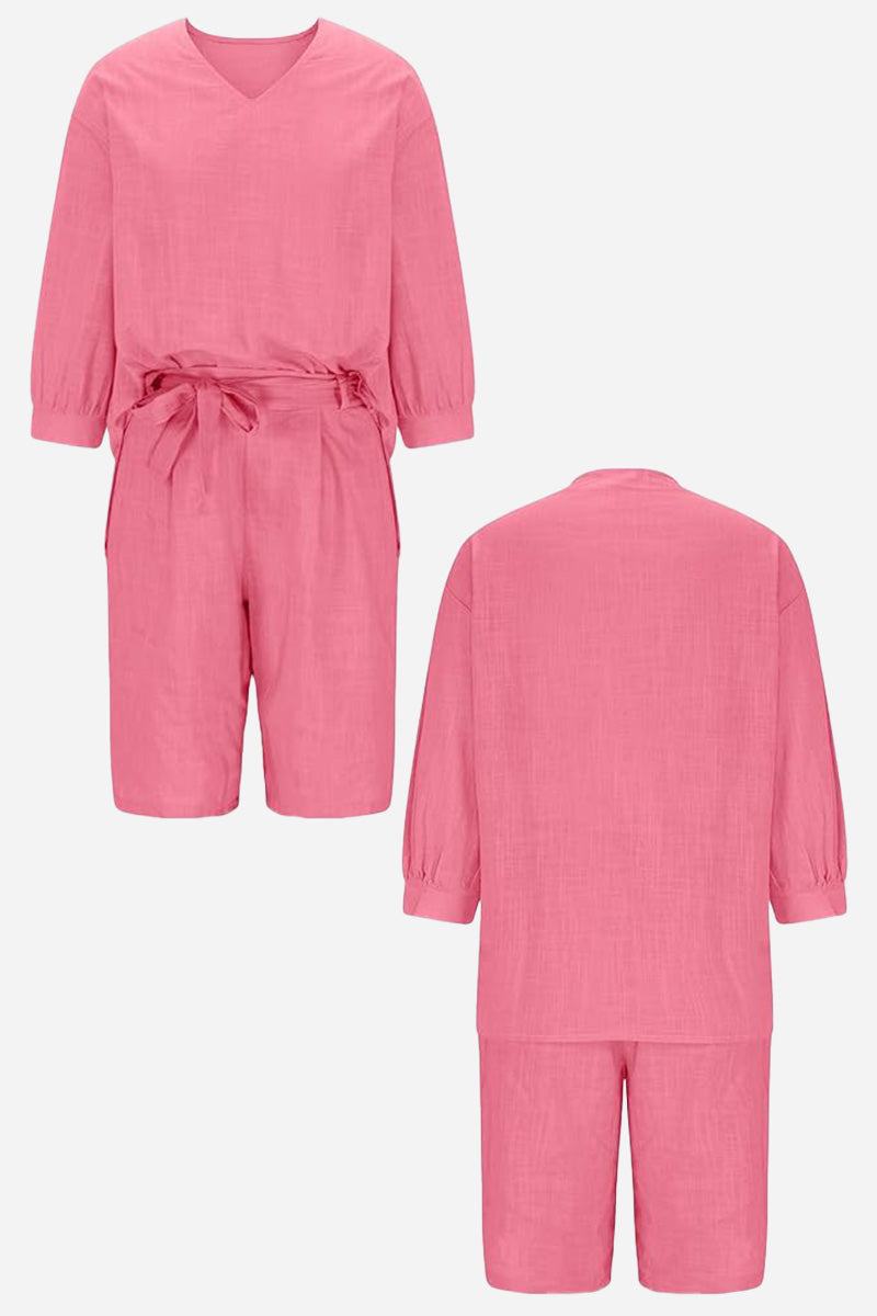 Pink two-piece set with loose long-sleeve shirt and high-waisted knee-length shorts in breathable cotton fabric