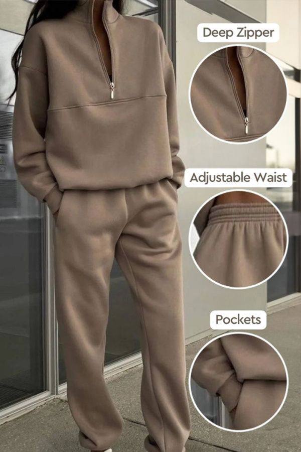 Brown cotton-blended two-piece tracksuit with deep zipper, adjustable waist, and pockets, featuring high collar and long sleeves for athleisure wear.