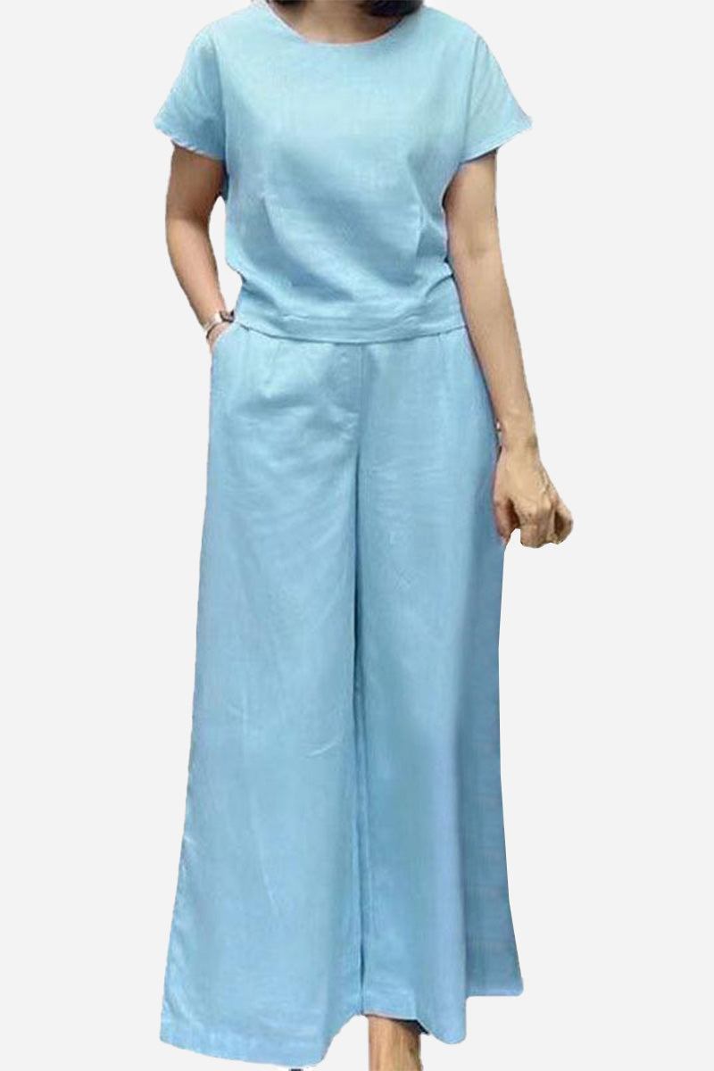 Woman wearing light blue short-sleeved bell pants two-piece set with loose fit and soft fabric