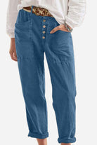 Blue casual button-down utility-chic trousers with deep pockets and rolled cuffs