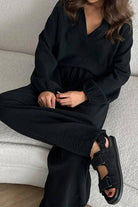 Black cotton collared two-piece set with bishop sleeves, loose fit, and V-neckline.