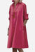 Pink long shirt-style dress with rolled sleeves and a relaxed fit